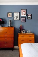 Vintage wooden chests of drawers in modern bedroom 
