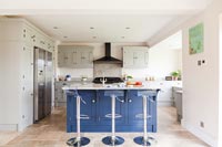 Dark blue island in modern kitchen 