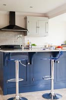 Blue island in modern kitchen 