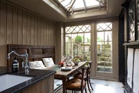 Country dining area with wood panelling