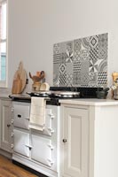 White AGA cooker with patterned tiling