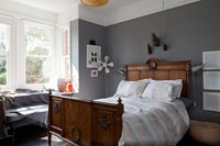 Vintage bed in grey bedroom