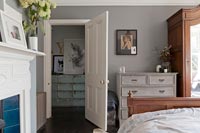 Open bedroom door and set of drawers