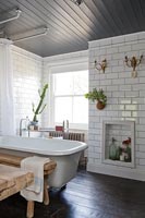 Modern bathroom with wall mounted plant pot and lights 