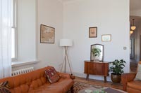 Vintage brown leather furniture in simple living room 