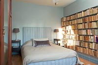 Large bookshelves in retro bedroom 