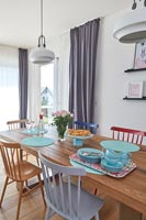 Turquoise crockery on modern dining room table 