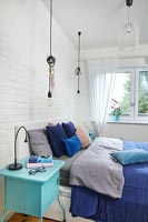 Modern bedroom in different shades of blue 