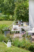 White furniture in country garden 