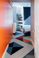 Colourful patterned flooring in modern bedroom 