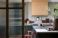 View through internal door to modern kitchen 