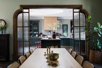 Modern dining room with view into kitchen 