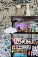 Book shelf with toys in modern childrens room 