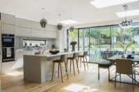 Modern kitchen with sliding glass wall to garden
