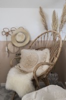 Sheepskin rug on wicker chair