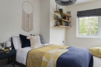 Modern bedroom with macrame wall hanging