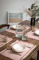 Detail of a dining table with set table