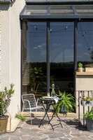 Terrace in front of a house with sliding folding door
