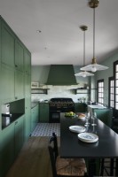 Green and black country kitchen-diner 