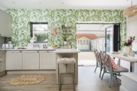 Modern kitchen with tropical wallpaper feature wall 