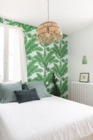 Modern bedroom with tropical wallpaper feature wall 