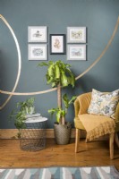 Houseplants next to gold chair