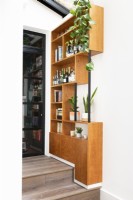 Custom made wood and metal bookcase with shelves and bar, 