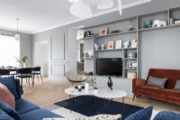 Modern living room with built-in wall unit and dining area