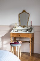 Small dressing table in bedroom 