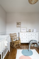 Wicker rocking chair in babys nursery 