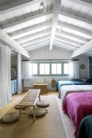 Dormitory style country bedroom with four beds 