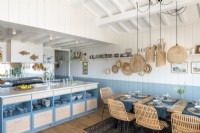 Blue and white kitchen-diner in cabin home 