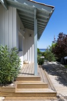 Steps up to veranda and porch of coastal home