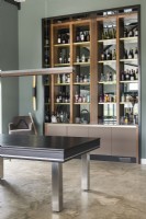 Drinks cabinet - unit in modern living room with concrete flooring