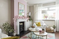 Modern living room with floral garland on mantelpiece