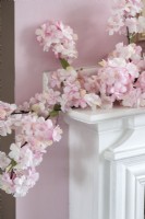 Pink floral garland on mantelpiece - detail 