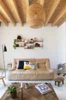 Beige leather sofa in modern white living room 