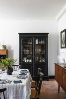 Black classic style dresser in country dining room