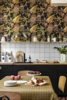 Vintage style wallpaper in modern kitchen-diner