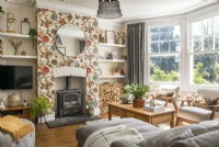 Floral wallpaper on chimney breast in modern living room