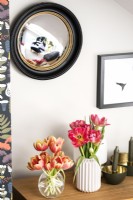 Vases of flowers on sideboard - detail