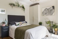 Modern bedroom with display of houseplants