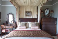 Classic bedroom with four poster bed and canopy