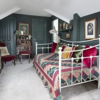 Daybed in classic bedroom with antique furniture