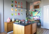 Modern kitchen with colourful artwork 
