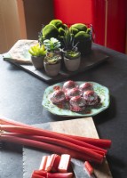 Food and small houseplants on kitchen worktop
