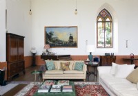 Classic style living room in coverted chapel with original stained glass
