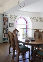 Classic dining area on mezzanine of converted chapel