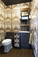 Bathroom with gold wallpaper
