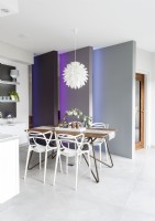 Dining are with partition panels in contemporary kitchen-diner 